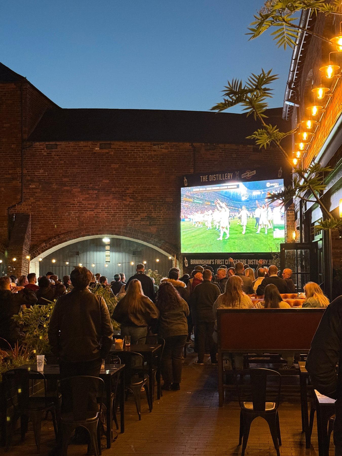 The outdoor screen and crowd at The Distillery Birmingham